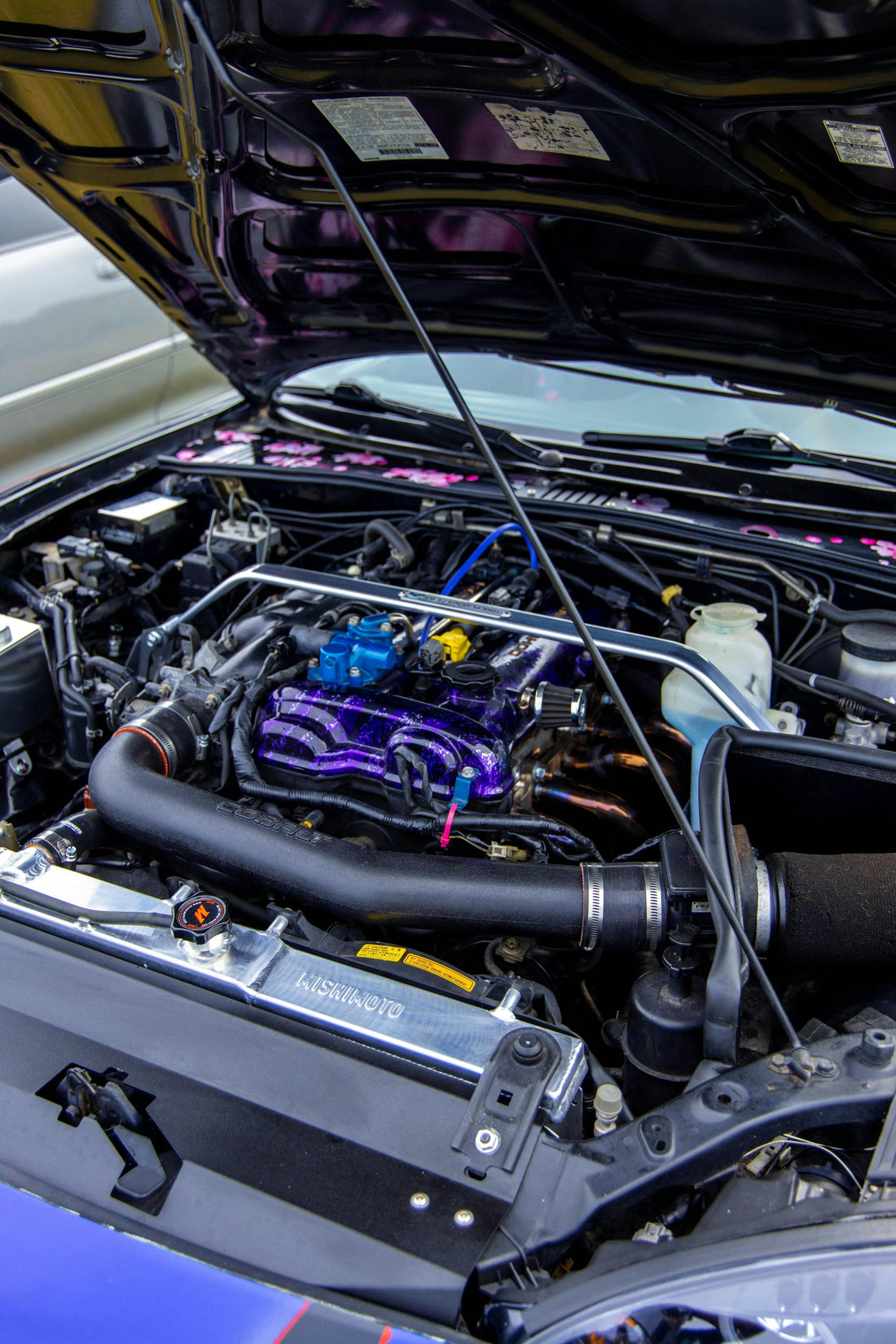 Modified performance car engine bay with aftermarket parts
