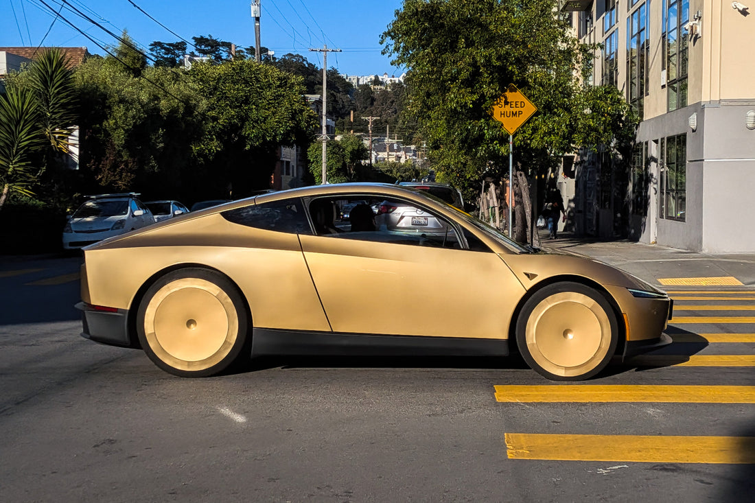 Tesla Cybercab robotaxi driving on a San Francisco street, June 2026