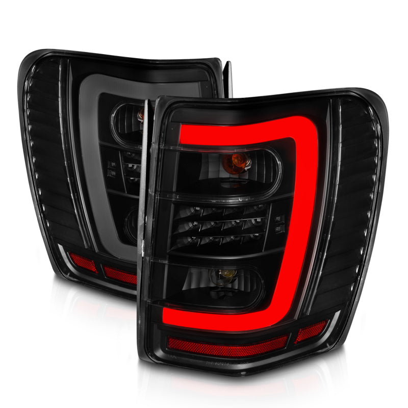 ANZO 1999-2004 Jeep Grand Cherokee LED Tail Lights w/ Light Bar Black Housing Smoke Lens 311395