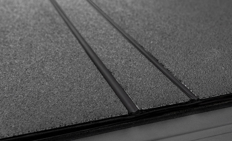 Access LOMAX Folding Hard Cover 19+ Chevy/GMC Full Size 1500 5ft 8in (w/ CarbonPro) Black Urethane B3020109